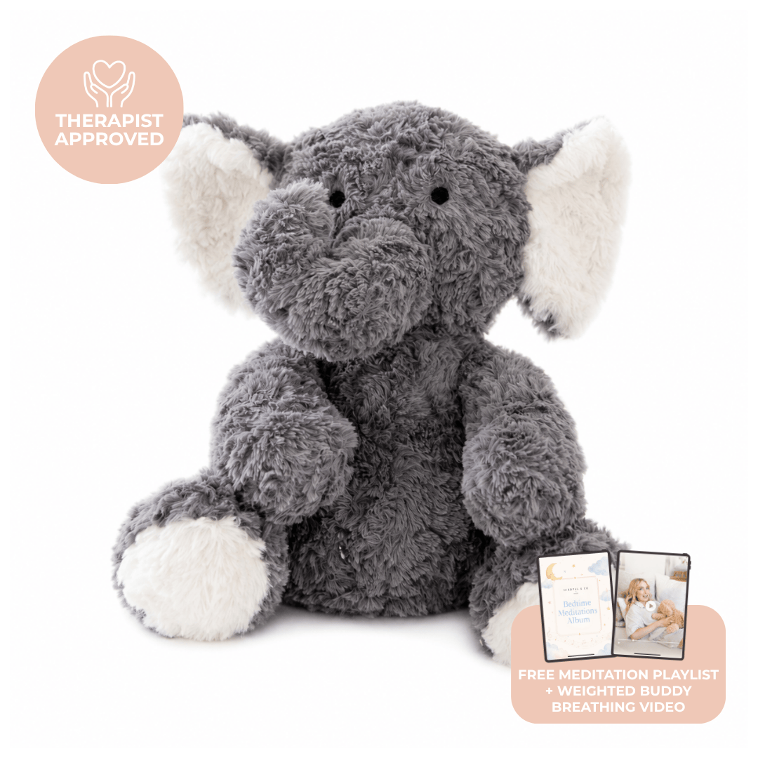 Eleanor the weighted elephant, a grey plush elephant with cream ears and feet, with a Therapist Approved badge and a card for the free meditation playlist and breathing video