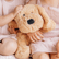 Close up of a child stroking the weighted puppy's head