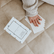 Child's hands dealing yoga snap cards beside the spotted box
