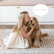 Girl kneeling to kiss a real cocker spaniel, with a speech bubble reading Hi, I'm Charlie