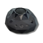 Open box black faceted Zenimal+ device, front angle view showing the speaker grille, power button and volume plus and minus controls