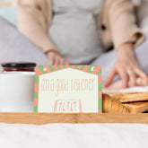 An I'm a good listener affirmation card propped on a breakfast tray