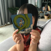 Child holding up the Jack and the Beanstalk story card from the Mindful Talk deck