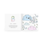 Coloring book open to the letter B page, B is for Breathe, with smiling cloud illustrations