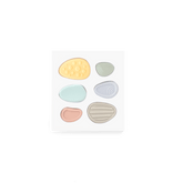Worry Stones box open to show six textured silicone stones in yellow, green, mint, blue, pink and grey