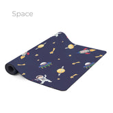 The Space yoga mat in navy, printed with planets, rockets and astronauts
