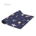 The Space yoga mat in navy, printed with planets, rockets and astronauts