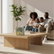 The Mindful Talk box on a coffee table with a family sitting together on the sofa behind