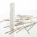 The Pick Up Sticks tube standing beside a scatter of the wooden sticks