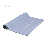 The Coal yoga mat, a plain blue grey mat with the Mindful and Co Kids wordmark