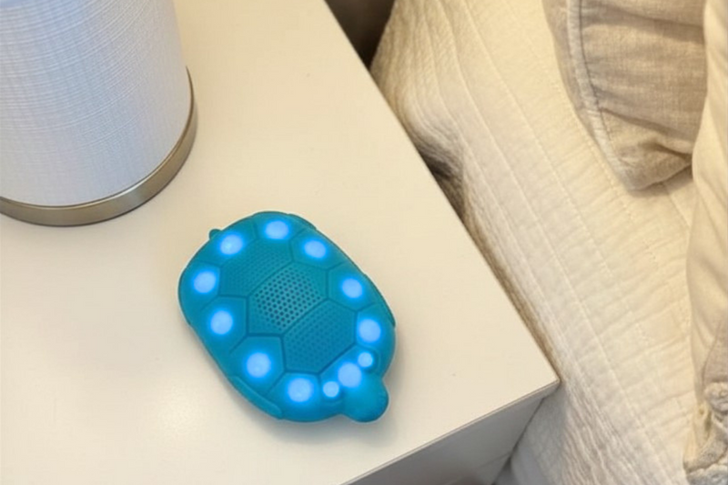 Zenimal Connect Kids sleep companion audio device on nightstand next to bed