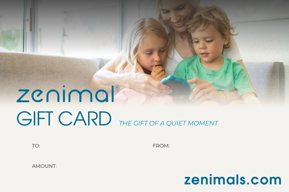 Zenimal gift card graphic with the words GIFT CARD "the gift of a quiet moment" zenimals.com. Photo of women holding a Zenimal with two kids on her lap