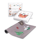 Yoga card box and card tray beside the grey Nature mat printed with a bear, trees and clouds