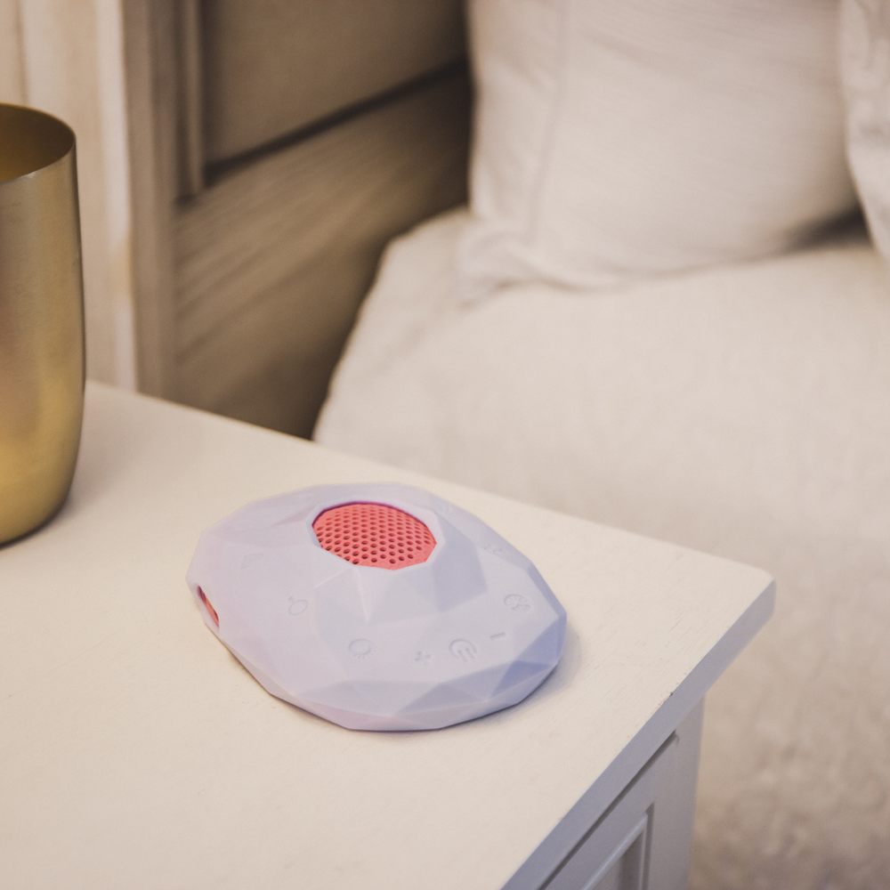 Geode Teen and Adult Meditation Device for Mindful Sleep Focus and Relaxation on a nightstand. Sleep sound machine.