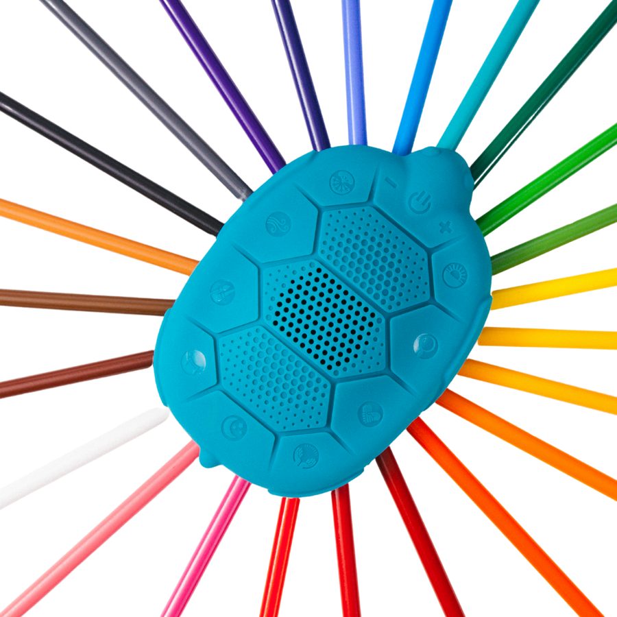 Zenimal Kids + and sleep sound machine to help kids sleep better, focus, and gain self regulation.  Zenimal Kids on a rainbow of colored pencils. 